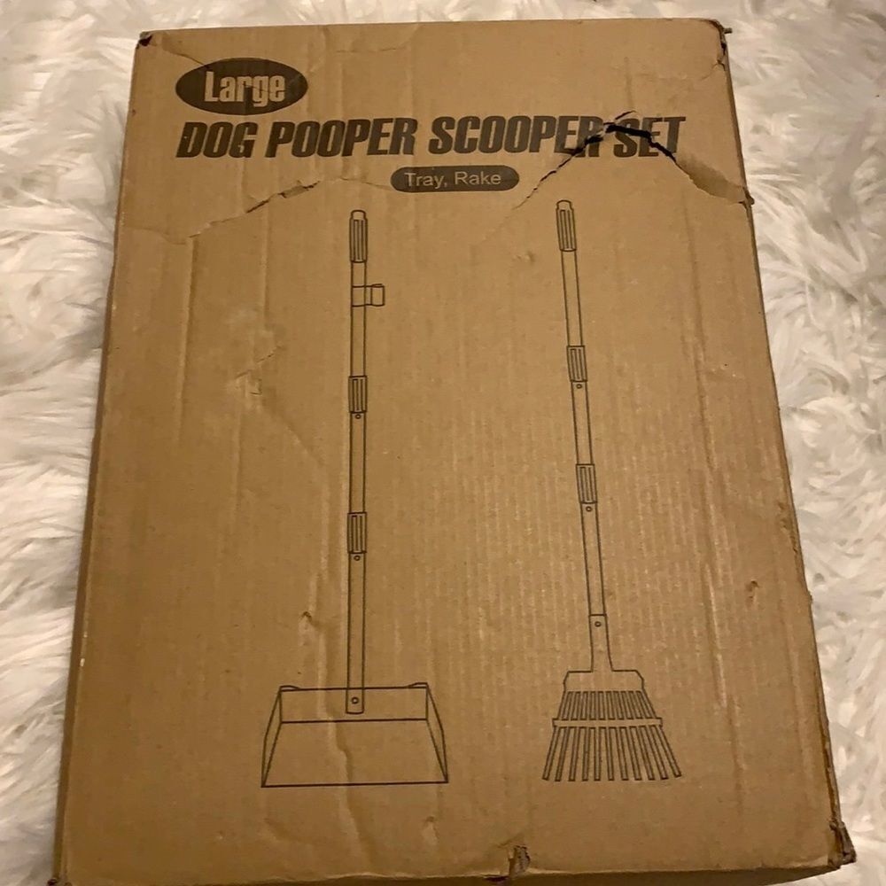 Dog pooper scooper set includes tray and rake